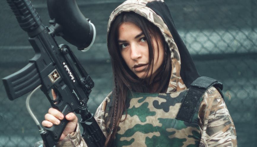Woman in Brown and Green Camoflage Uniform
